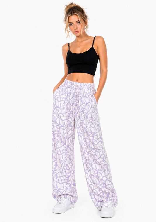 Women’s lavender abstract print wide leg joggers by Montx The Clothing Brand, relaxed fit and comfortable for casual wear.