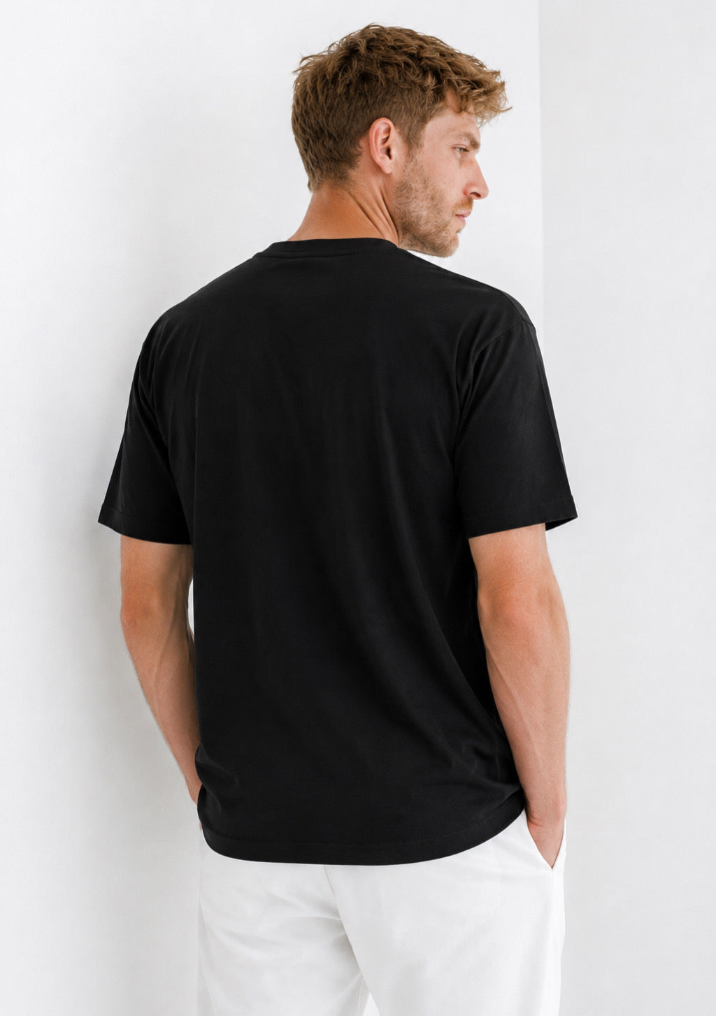 Montx Men’s black half sleeve round neck T-shirt with regular fit, displayed flat on a white background.