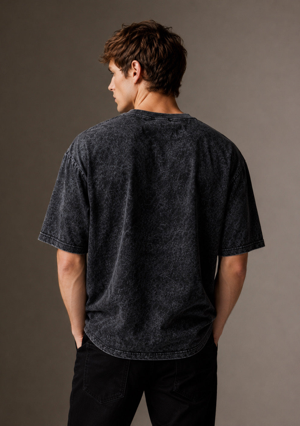 Montx oversized acid wash T-shirt with streetwear style, featuring a relaxed fit and faded, vintage-inspired design.