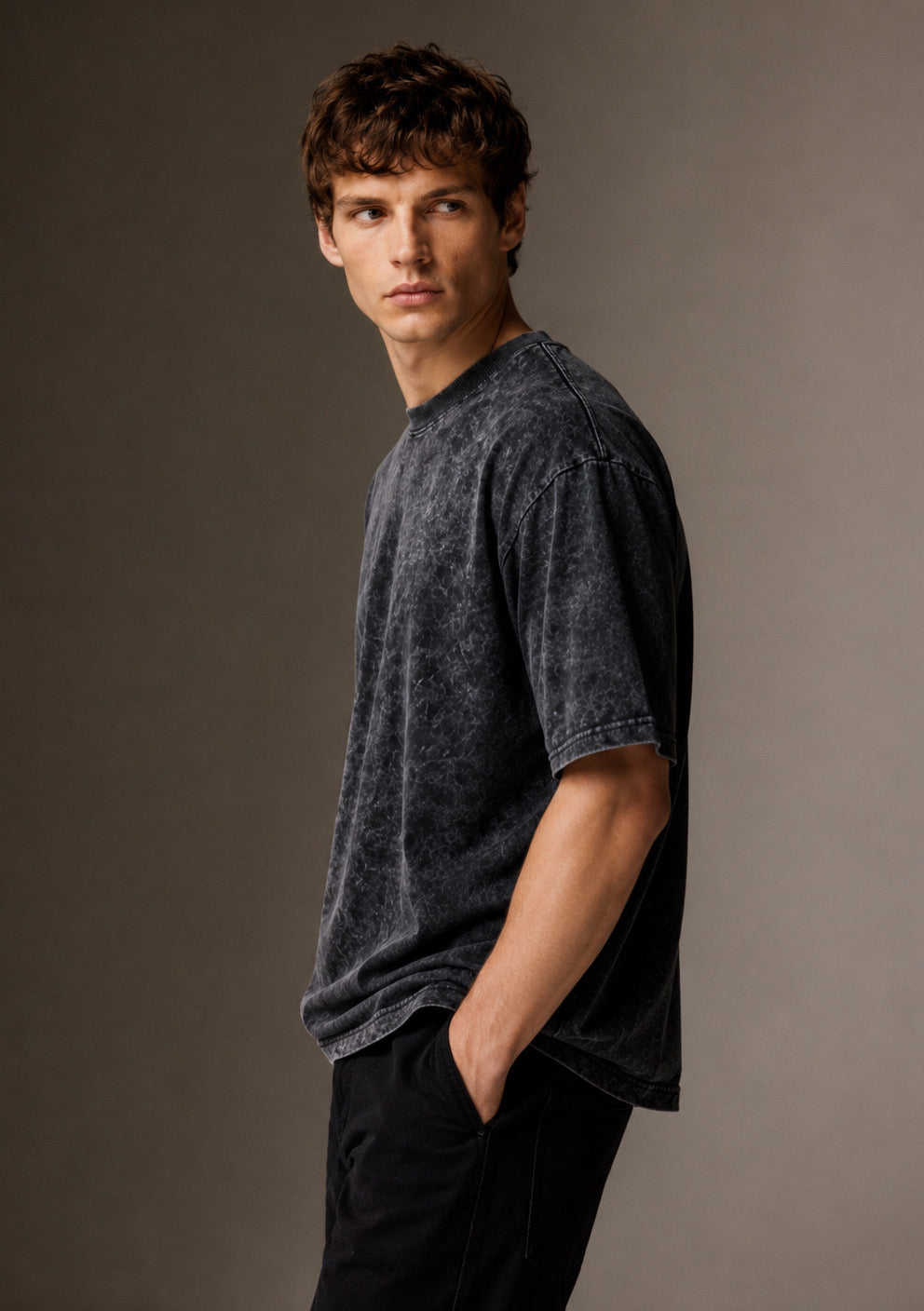 Montx Oversized Acid Wash T-Shirt showcasing a relaxed fit, distressed acid wash fabric, and casual streetwear style.