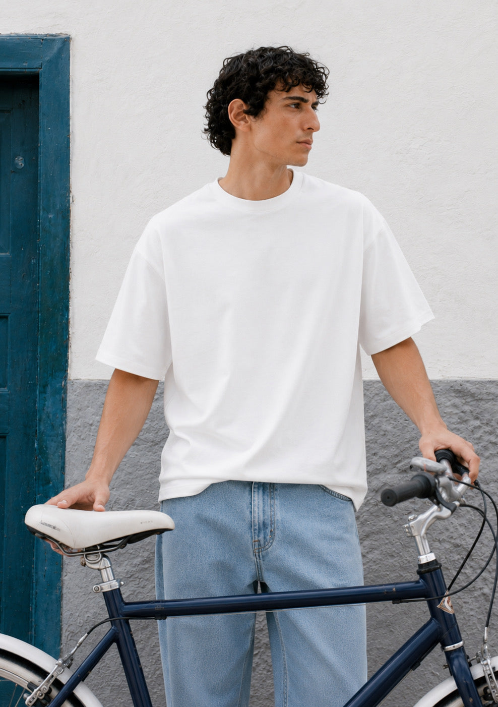 Montx Essential boxy fit white T-shirt for men, casual style, plain cotton fabric, displayed on a neutral background.
