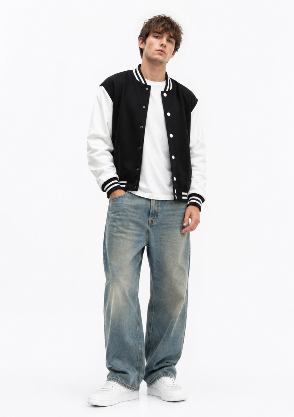 Montx Classic Varsity Jacket in black with white sleeves, featuring snap buttons and a ribbed collar, shown on a hanger.