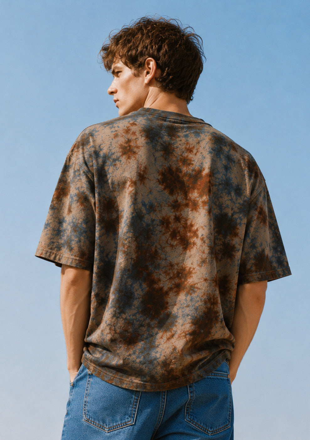 Montx Men's charcoal tie-dye oversized round neck T-shirt with relaxed fit, displayed on a hanger against a plain background.