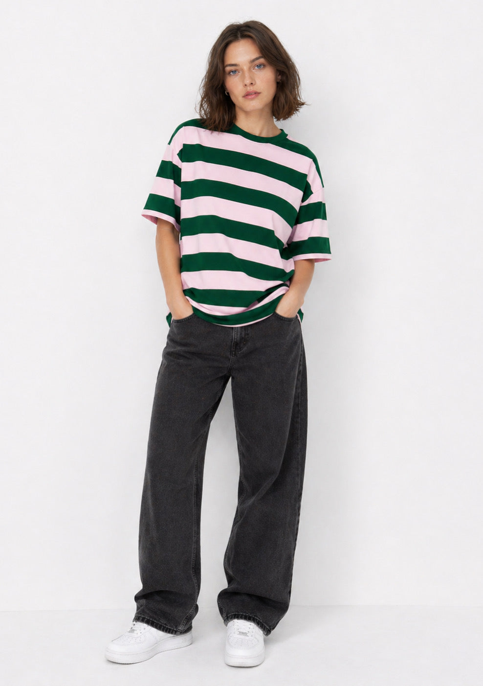 Montx women’s rose pink and green striped oversized T-shirt with a relaxed fit and bold pattern.