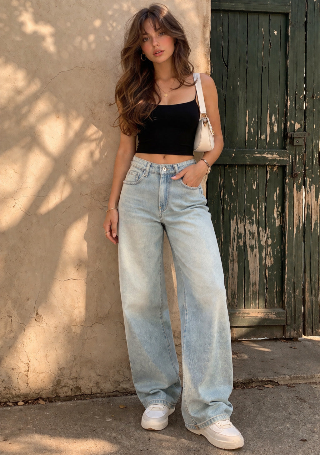 Montx Women’s dusty light blue straight fit denim jeans displayed on a model, showcasing the classic style and fit.