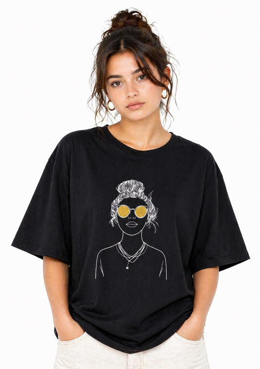 Montx Women’s black graphic oversized T-shirt featuring bold design, casual fit, and comfortable cotton fabric.