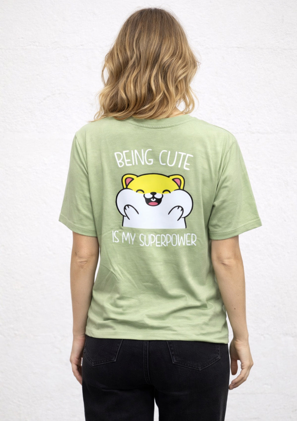 Montx Women's sage green printed T-shirt with a cute statement design, featuring colorful floral and graphic patterns.