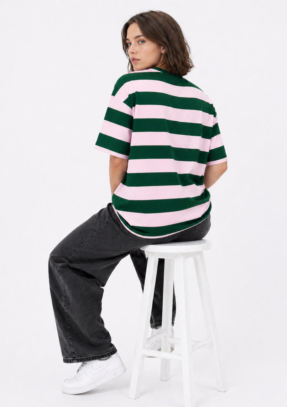Montx Women’s rose pink and green striped oversized T-shirt with a relaxed fit and bold horizontal stripes.