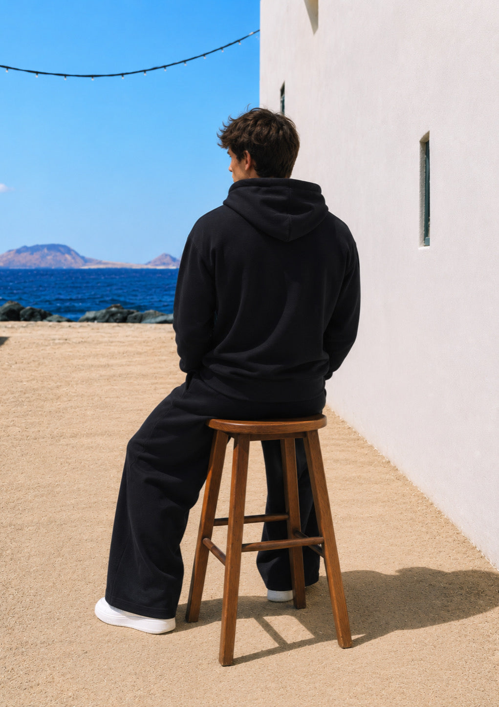 Black Montx men's oversized drop shoulder hoodie with a relaxed fit, featuring a casual streetwear style and soft fabric.