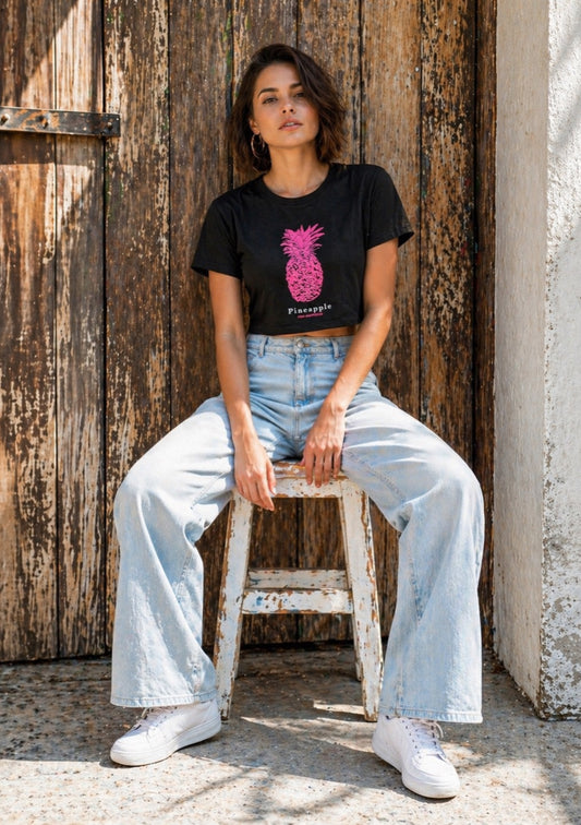 Women’s black crop T-shirt by Montx The Clothing Brand featuring a pineapple puff print design.