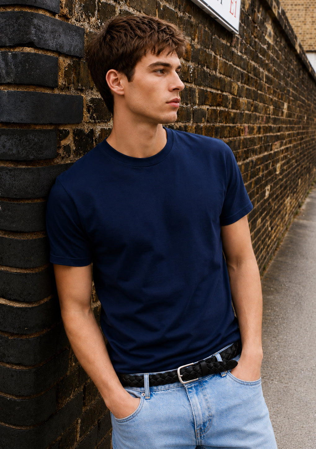 Montx men's navy blue regular fit round neck T-shirt displayed on a hanger, showcasing casual comfort and classic style.