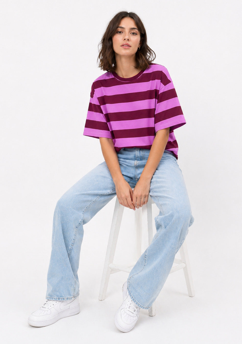 Montx women's purple oversized T-shirt with bold striped pattern, casual fit, and soft fabric, displayed on a hanger.