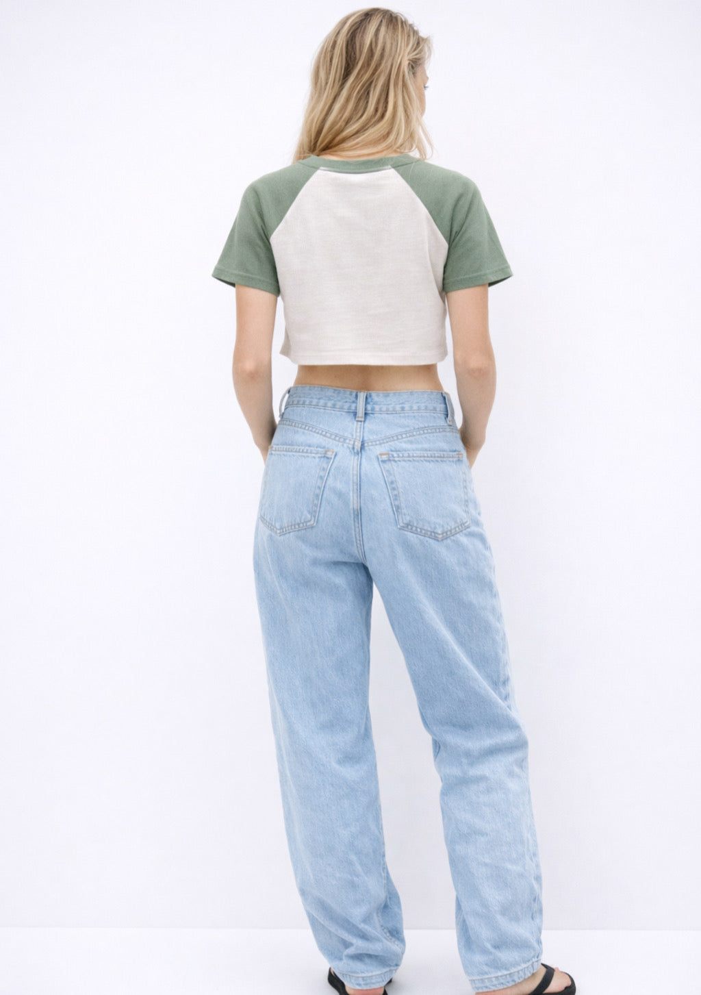 Montx women's crop T-shirt in sage green and white with a stretch fit, featuring a casual, stylish design on a plain background.