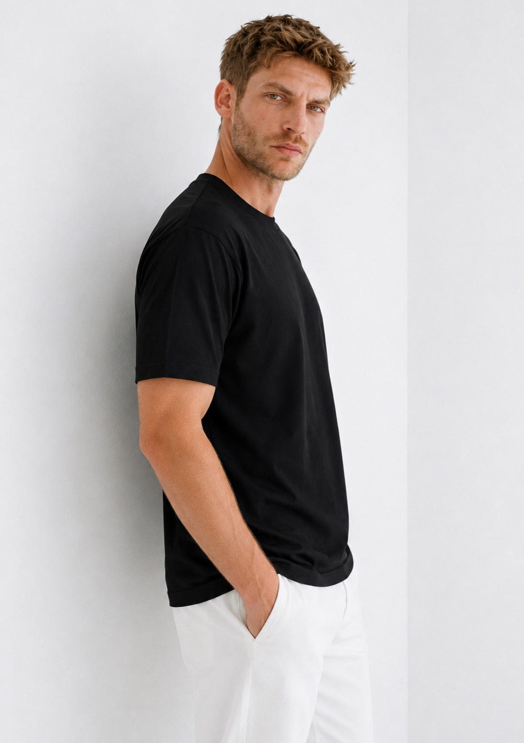 Montx men's black half-sleeve round neck T-shirt, regular fit, front view showing soft cotton fabric and classic design.