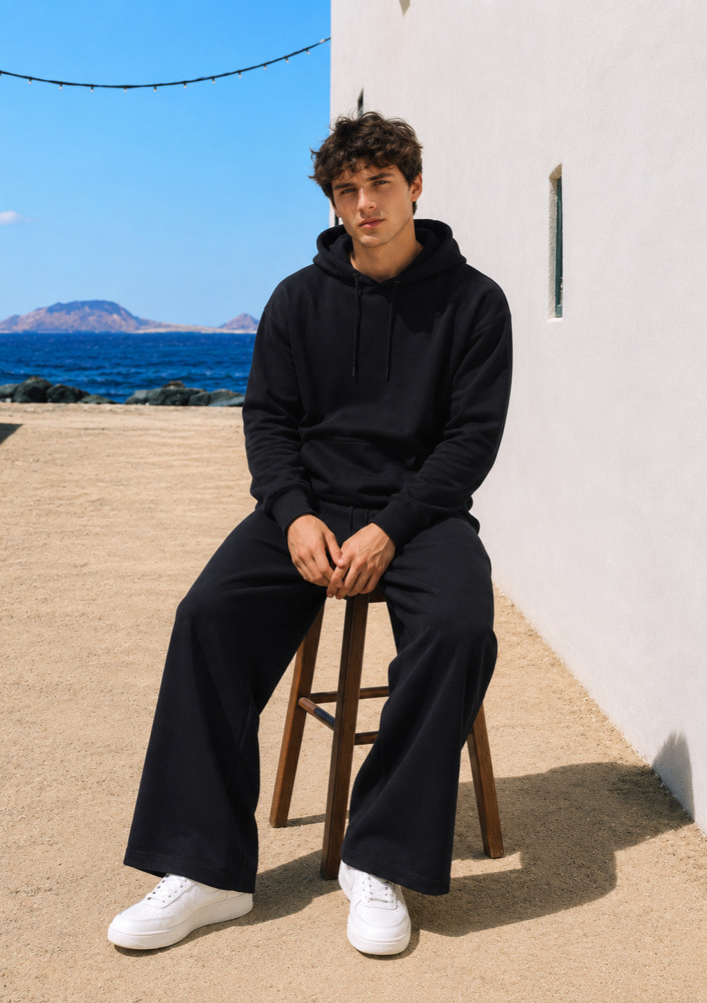 Black oversized drop shoulder hoodie for men by Montx The Clothing Brand, featuring a relaxed streetwear style and comfortable fit.