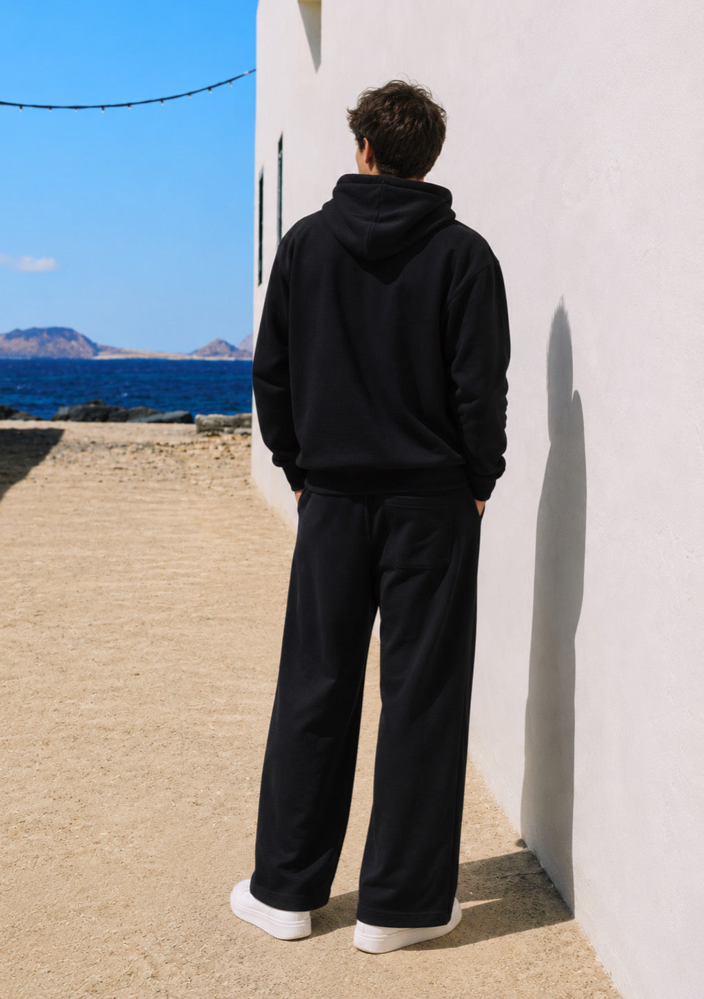 Black oversized drop shoulder hoodie for men by Montx The Clothing Brand, featuring a relaxed streetwear style.