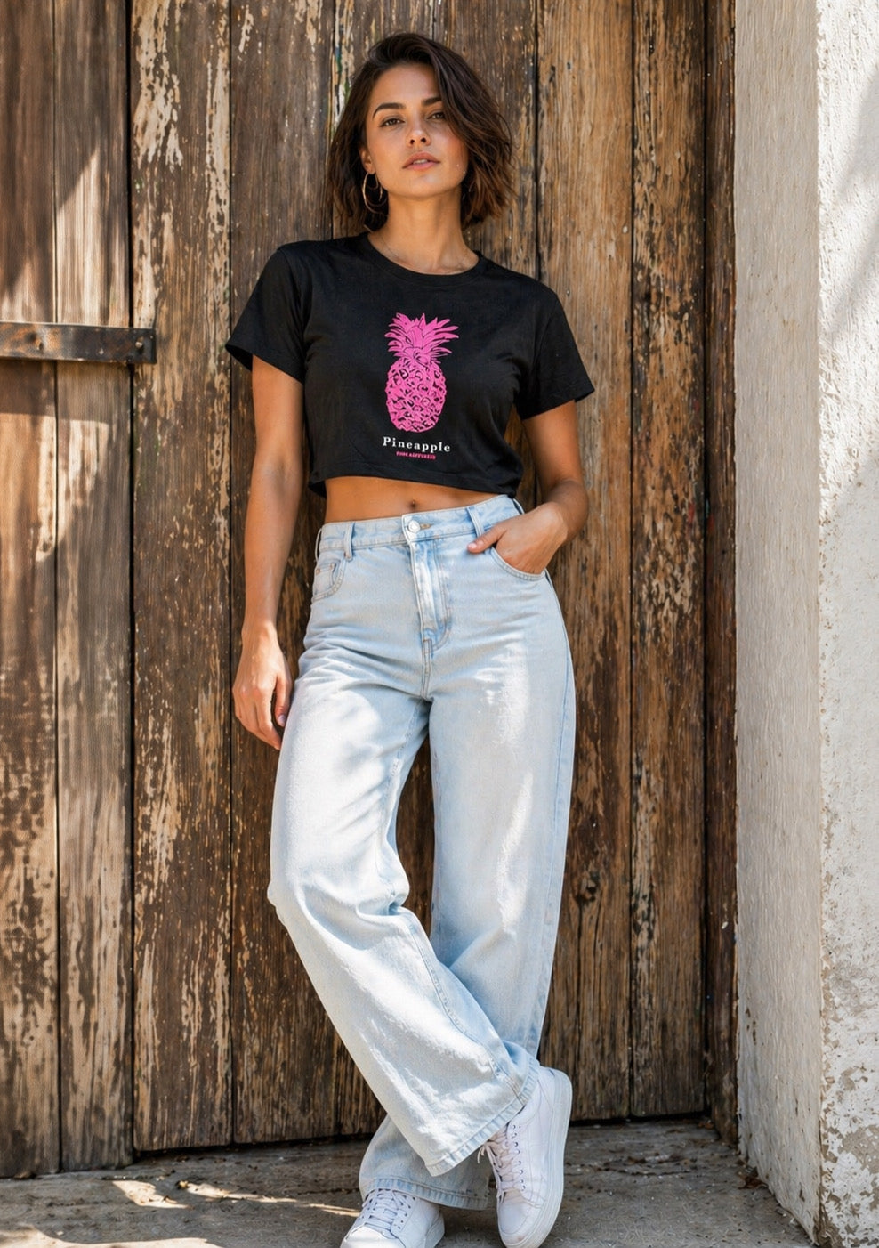 Women’s black crop T-shirt by Montx The Clothing Brand featuring pineapple puff print design.