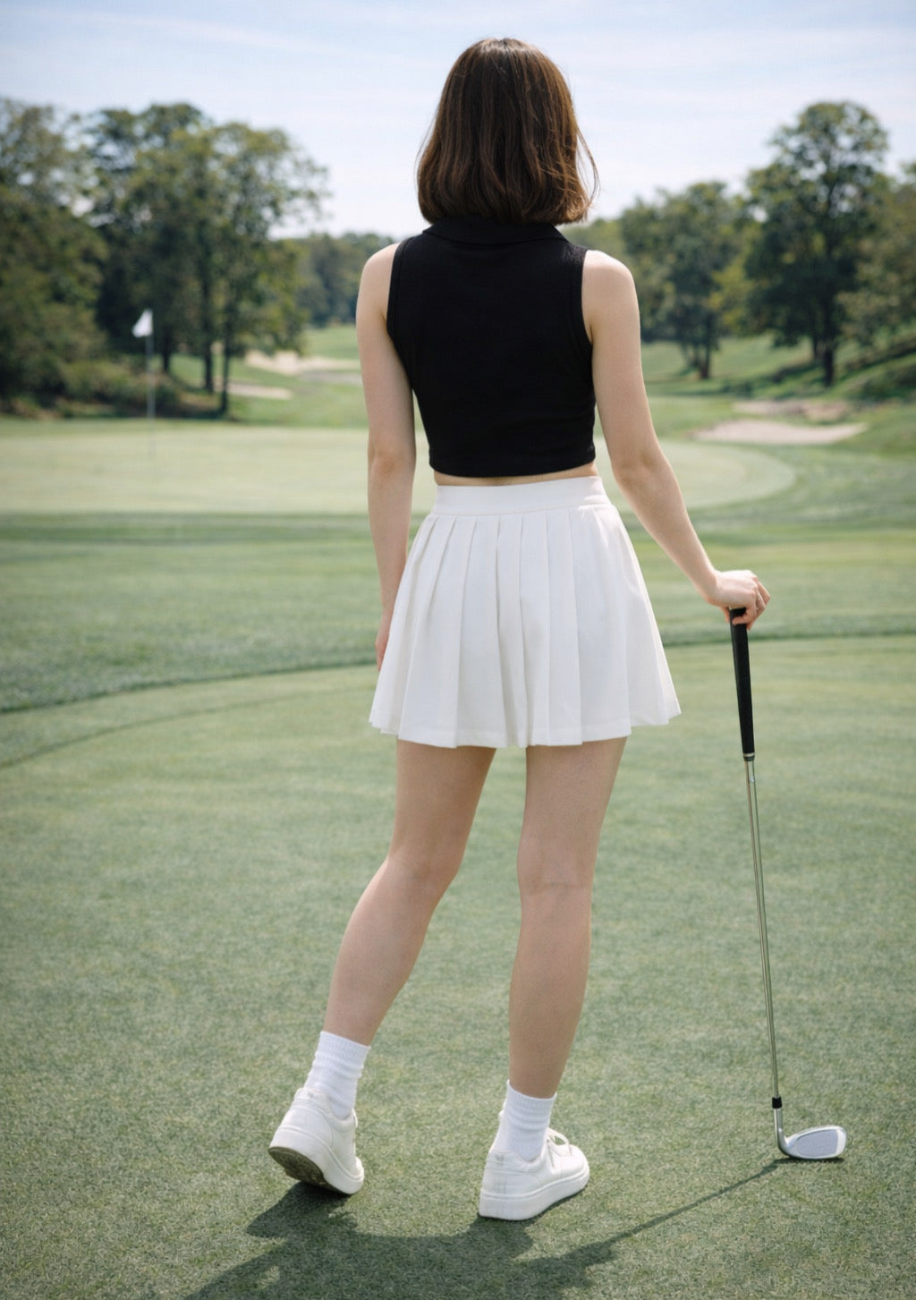 Black sleeveless collared crop top for women by Montx The Clothing Brand, shown on a model with a fitted design.