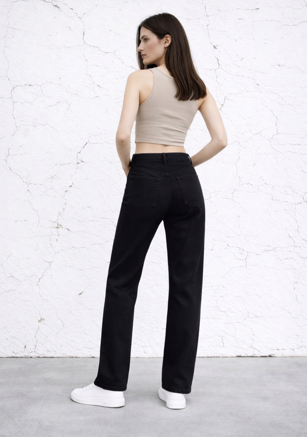 Black cotton-rich denim jeans by Montx The Clothing Brand, straight fit, shown on a model with pockets and belt loops.