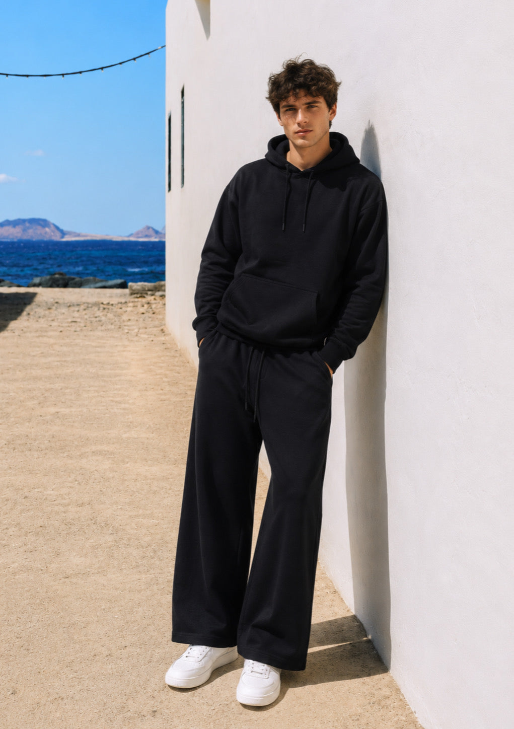 Black oversized drop shoulder hoodie by Montx Men’s streetwear essential, featuring a relaxed fit and soft fabric.