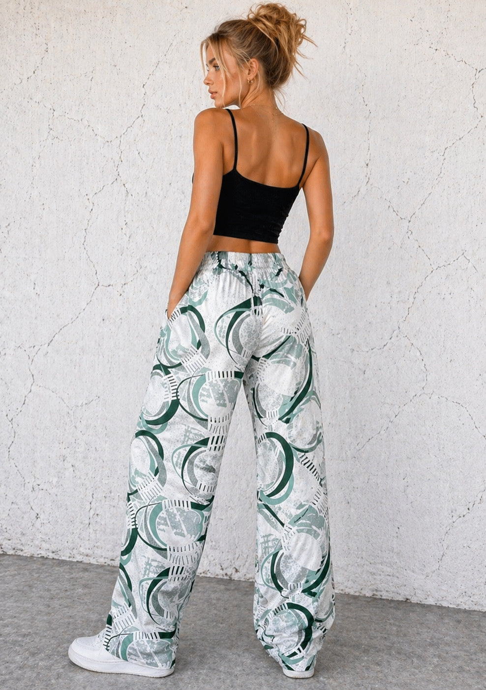 Montx Women's sage green abstract print wide-leg joggers with a relaxed fit, featuring a comfortable waistband and flowing fabric.