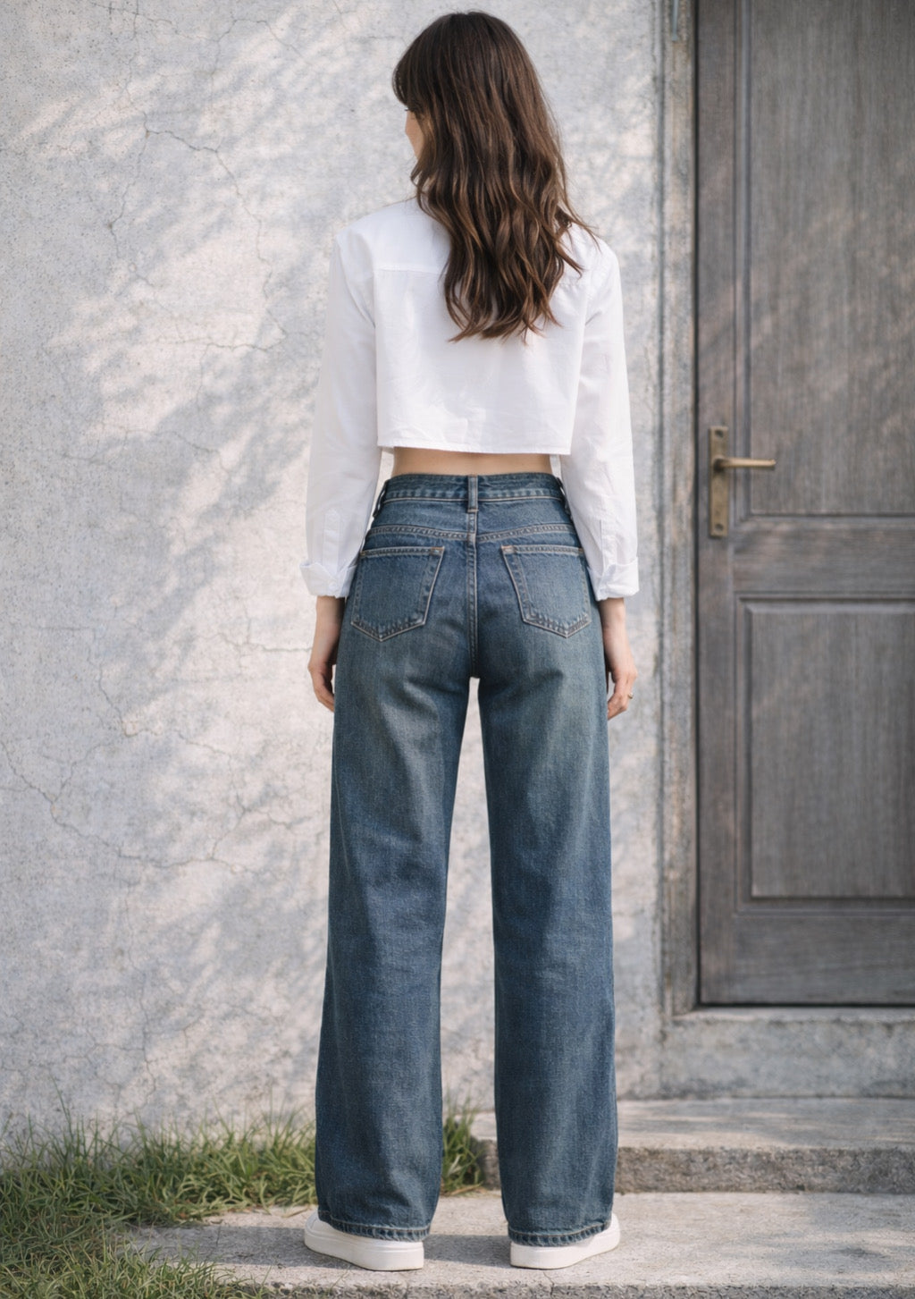 Montx women's vintage dark dusty blue straight-fit denim jeans displayed on a hanger with a plain background.